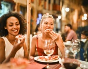 https://www.pexels.com/photo/woman-eating-bruschetta-1537635/ -- taste of nyc; dining; dinner